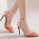 Pink high-heeled shoes with lace detailing on a neutral background, Obroi