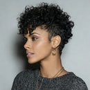 Woman with styled black hair against a gray background, Obroi
