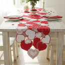 Dining table set with a heart-themed table runner, plates, and napkins, Obroi