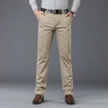 Person wearing beige pants with a gray background, Obroi