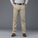 Person wearing beige pants with a gray background, Obroi