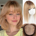 A blonde wig with straight bangs, shown on a woman's head, on a mannequin head, and from the underside to show the attachment area. The wigs are light golden blonde with subtle brown lowlights, Obroi