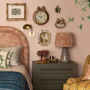 Decorative bedroom with a bed, nightstand, lamp, and wall clock, Obroi