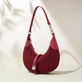 Red handbag with a strap on a light background, Obroi
