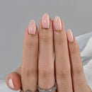Hand with pink nail polish on a gray background, Obroi