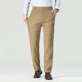 Person wearing beige pants with a plain background, Obroi