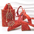 Red embellished shoes and handbag on a white background with 'Obroi' branding.