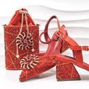 Red embellished shoes and handbag on a white background with 'Obroi' branding.