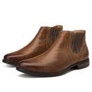 Pair of brown leather Chelsea boots on a white background ,Obroi