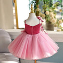 Pink dress on a mannequin with a blurred indoor background, Obroi