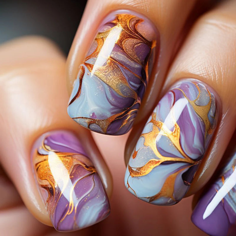 Nails with marbled design in purple, gold, and blue on a neutral , Obroi