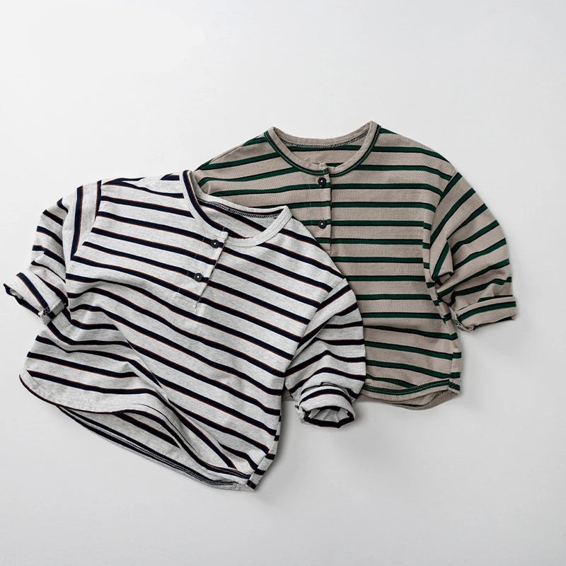 Two striped baby rompers on a white background with Obroi branding.