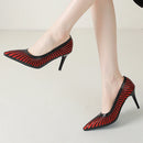 Black and red high-heeled shoes on a neutral background, Obroi