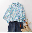 Floral blouse with denim jeans and a straw bag on a white background, Obroi