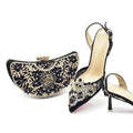 Black high-heeled shoes with gold embellishments and a matching clutch on a white background, Obroi