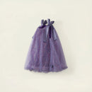A purple glittery tulle dress with ribbon bows at the shoulders, displayed against a light cream background with decorative text reading 'Obroi' and 'Obroi'.