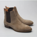 Pair of brown suede Chelsea boots on a light gray background, Obroi