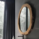 Oval mirror with wooden frame on a gray wall next to a window with dark curtains, Obroi