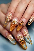 Nails with bee and floral design on a blue background, Obroi