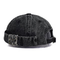 Black denim cap with distressed details on a white background, Obroi