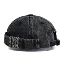Black denim cap with distressed details on a white background, Obroi