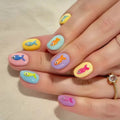 Nails with fish design in various colors on a neutral background, Obroi