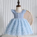 Light blue dress with floral skirt on a mannequin against a white wall, Obroi