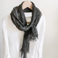 Gray scarf draped over a white shirt on a mannequin against a plain background, Obroi