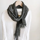 Gray scarf draped over a white shirt on a mannequin against a plain background, Obroi