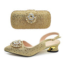 Gold studded shoe and matching handbag set on a white background, Obroi