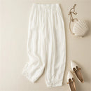 White pajama pants with a bra and shoes on a beige background, Obroi
