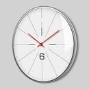 Wall clock with red and black hands on a white face against a gray background, Obroi