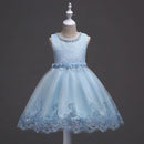 Light blue lace dress on a mannequin against a dark background, Obroi