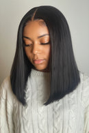 Three-panel collage showing a straight black wig with a center part. The left panel shows a woman wearing the wig, while the top-right and bottom-right panels show mannequin heads from the front and back against a plain light gray background, Obroi