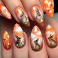 Nail art with rabbits and flowers on an orange background, Obroi