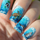 Nails with ocean-themed design featuring a turtle, penguin, and dolphin on a blue watercolor background, Obroi