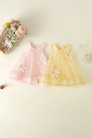 Two baby dresses, one pink and one yellow, on a light background with decorative elements, Obroi