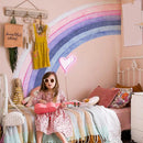 Child in a colorful bedroom with a rainbow mural and neon light, Obroi