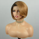 A short bob wig with a dark brown root and warm golden-brown highlights, styled on a female mannequin bust against a neutral gray background, Obroi