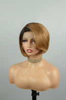 A short bob wig with a dark brown root and warm golden-brown highlights, styled on a female mannequin bust against a neutral gray background, Obroi