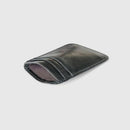 Black leather cardholder on a light gray background, Obroi