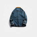Blue denim jacket on a white background