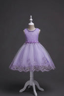 Lavender lace dress on a mannequin against a dark background, Obroi