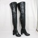 Black leather knee-high boots on a white background with 'Obroi' branding.