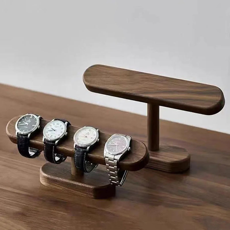 Wooden watch stand with four watches on a wooden surface, Obroi