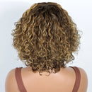Mannequin head with curly brown hair on a white background, Obroi