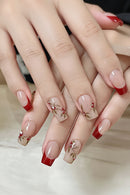 Nails with red and beige design on a neutral background, Obroi
