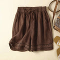 Brown shorts with lace trim on a beige background, Obroi