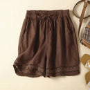 Brown shorts with lace trim on a beige background, Obroi