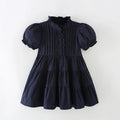 Navy blue dress with puff sleeves on a white background, Obroi